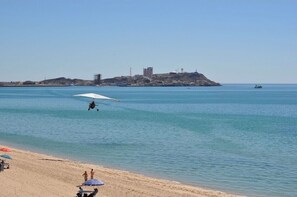 On the beach, sun loungers, beach towels
