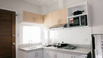 Fridge, microwave, electric kettle, dining tables