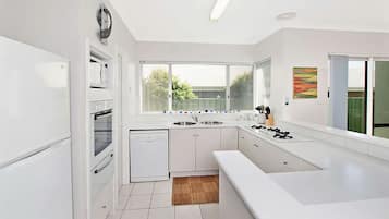 Microwave, oven, dishwasher, dining tables