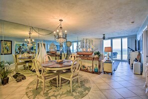 Enjoy meals in this elegant dining area with a large round table and vintage-style chairs.