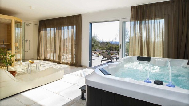 A modern bathroom with a shower, a bathtub, and a large window. - Villa A.R.T. Viskovici (Koromačno)