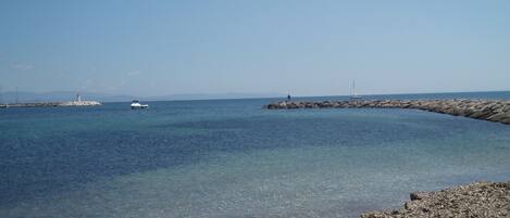On the beach, sun-loungers
