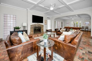 TV, fireplace, books, offices