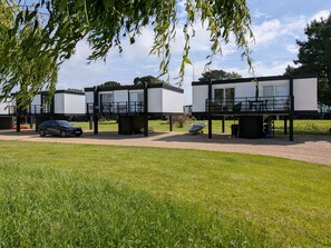 A modern building with a car parked in front. - 4 Avocet Quay , Emsworth  - sleeps 4 guests  in 2 bedrooms (Emsworth)