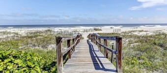 Upscale,  newly furnished, single level end unit, with 180 degree view 