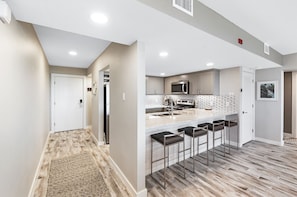 Fridge, microwave, oven, stovetop - Beachfront Boutique Resort  |  Coastal Retreat  |  Casa Condo 203 (Port Aransas)