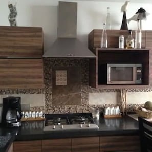 Fridge, microwave, stovetop, coffee/tea maker