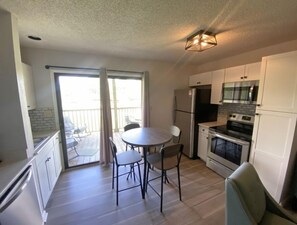 Fridge, microwave, stovetop, coffee/tea maker