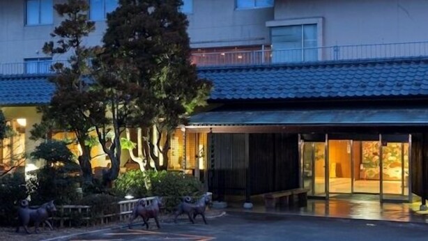 A multi-story building with a flat roof, large windows, and a covered entrance area. - Aiken to Sugosu Honkaku Ryokan Gekka (Awara)