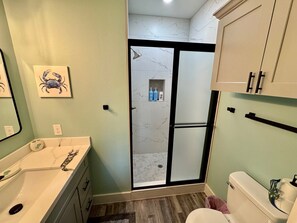 Shower, hair dryer, towels, soap