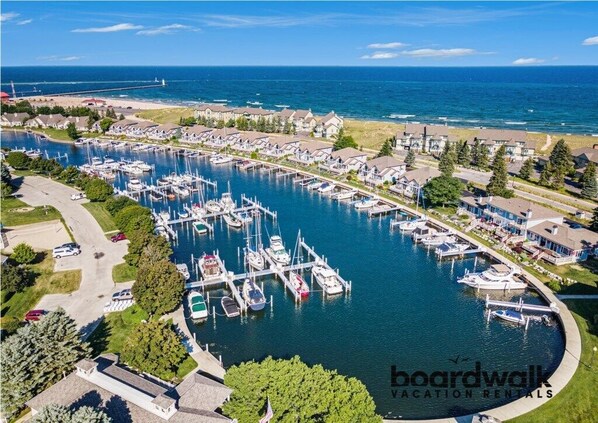 Stroll along the marina, surrounded by boats and residential buildings.