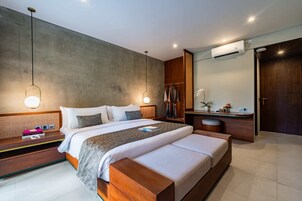 Deluxe Room, Balcony, Pool View | In-room safe, desk, laptop workspace, soundproofing