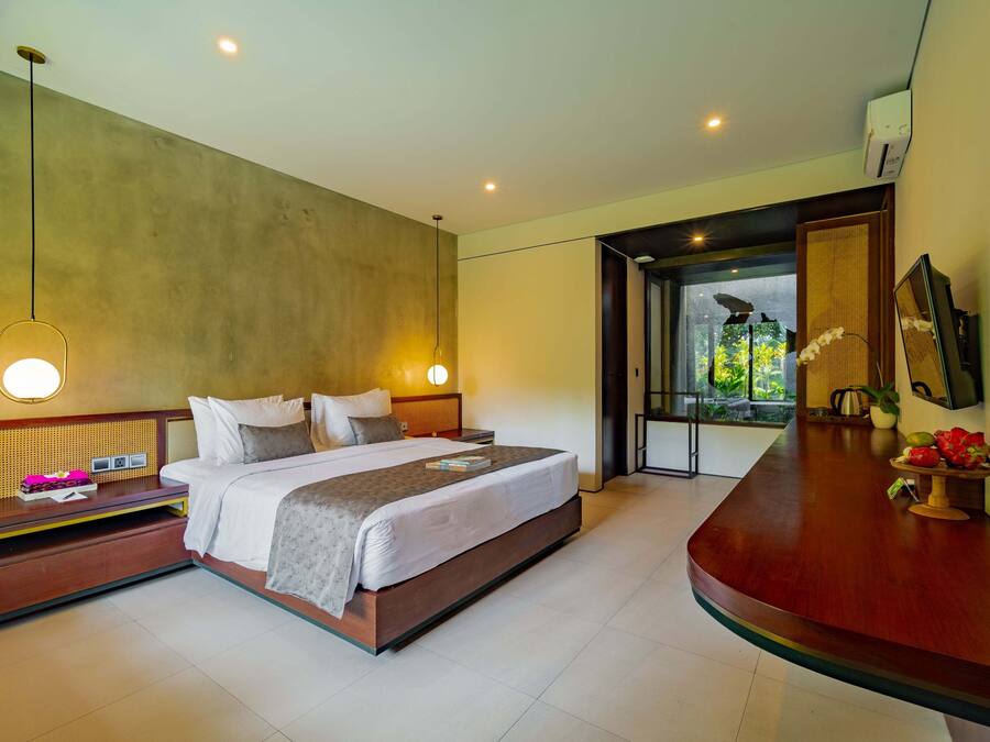 Deluxe Room, Pool Access, Pool View | In-room safe, desk, laptop workspace, soundproofing