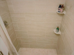 Combined shower/tub, hair dryer, towels, soap