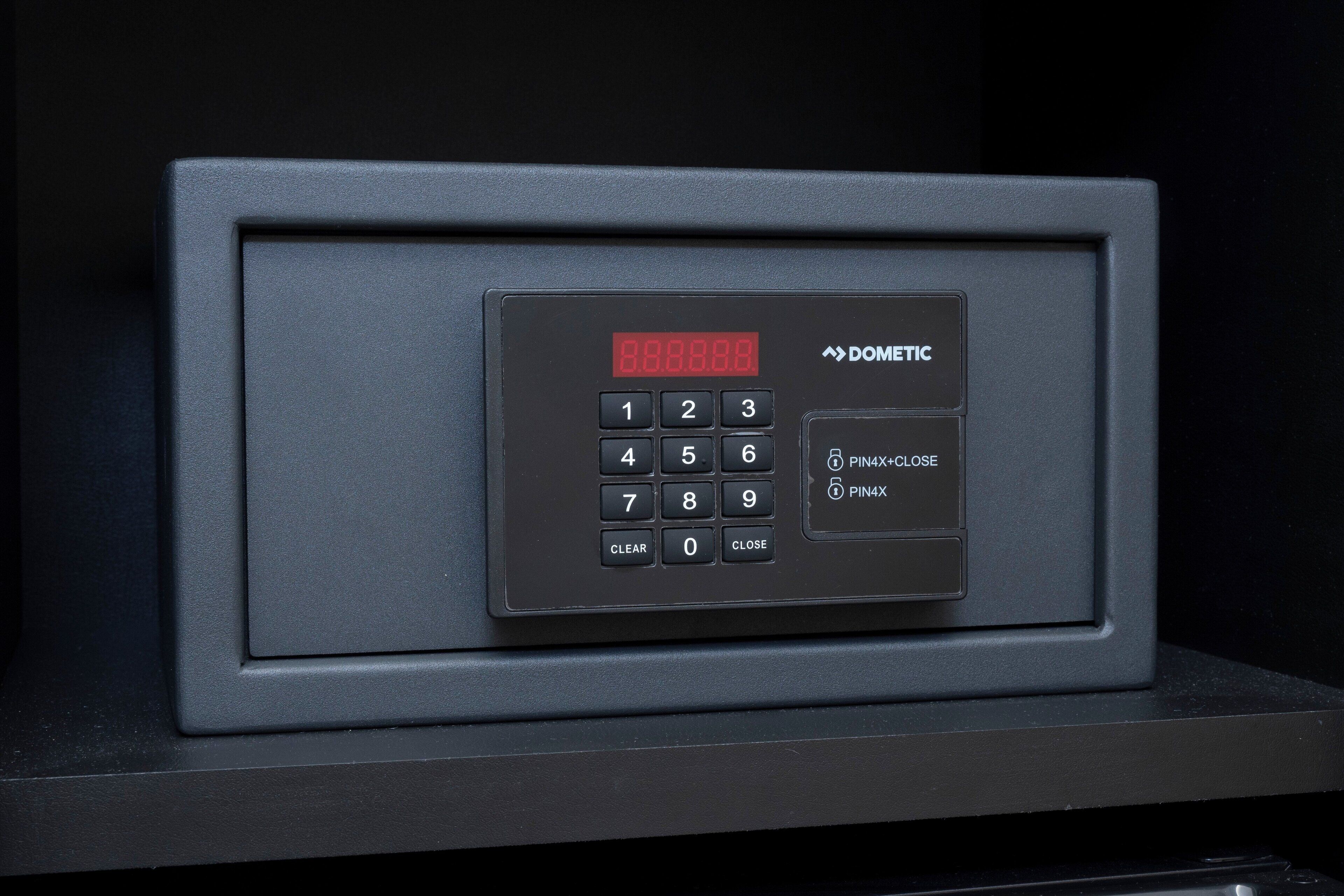 A black security keypad with a digital display, PIN4X close buttons, and a clear button.