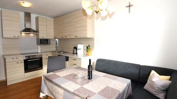 Microwave, dishwasher, rice cooker, dining tables