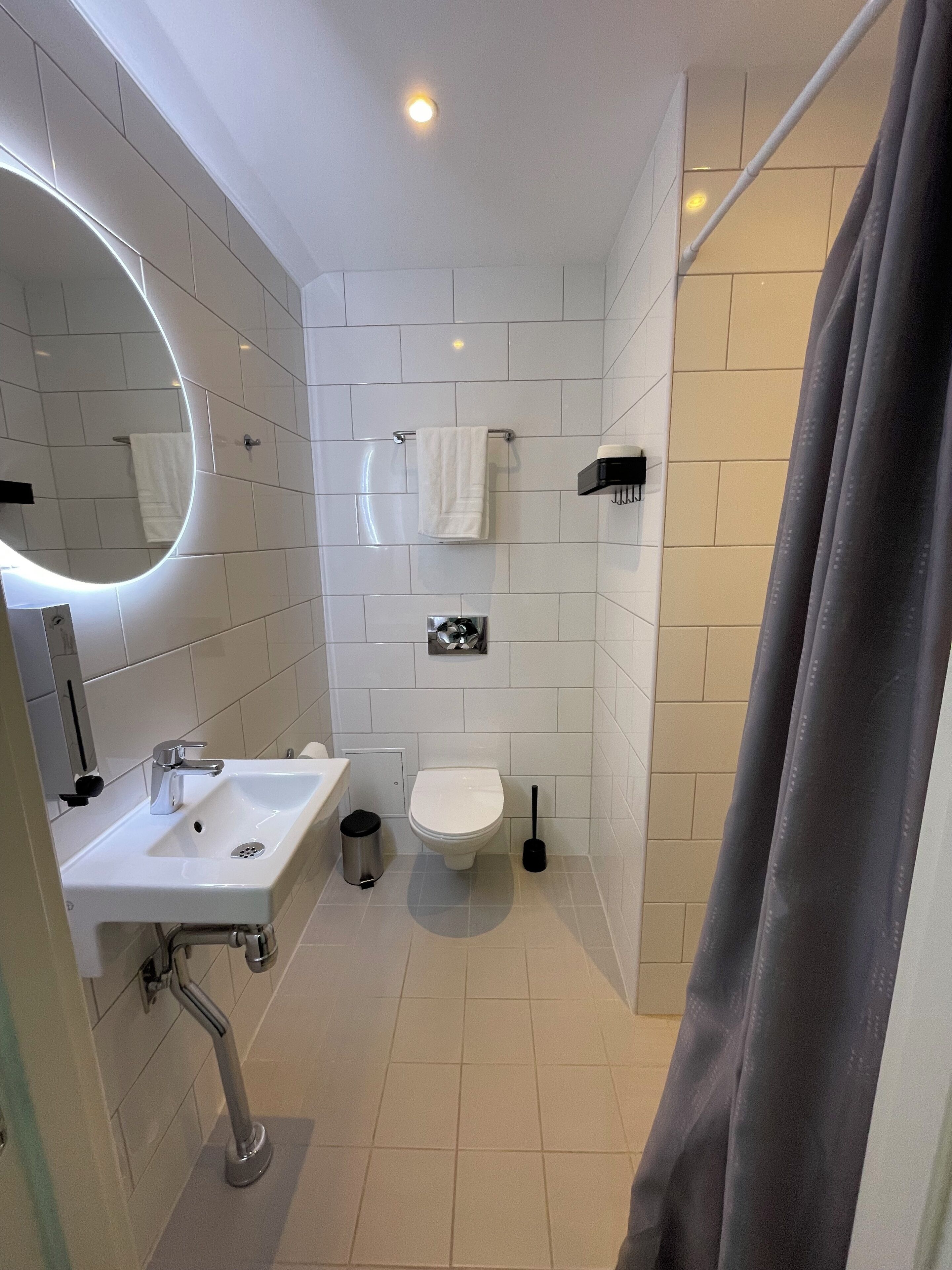 standard twin room | bathroom | shower, rainfall showerhead, hair dryer, heated floors