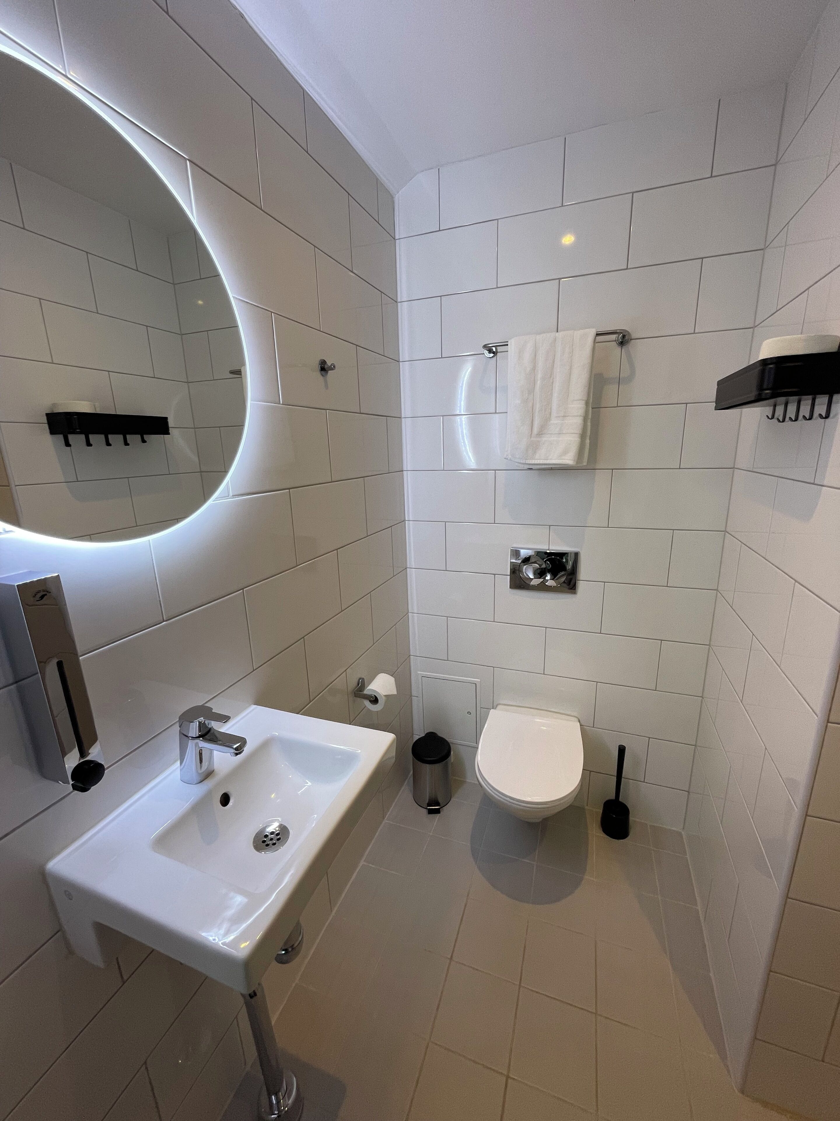 standard twin room | bathroom | shower, rainfall showerhead, hair dryer, heated floors