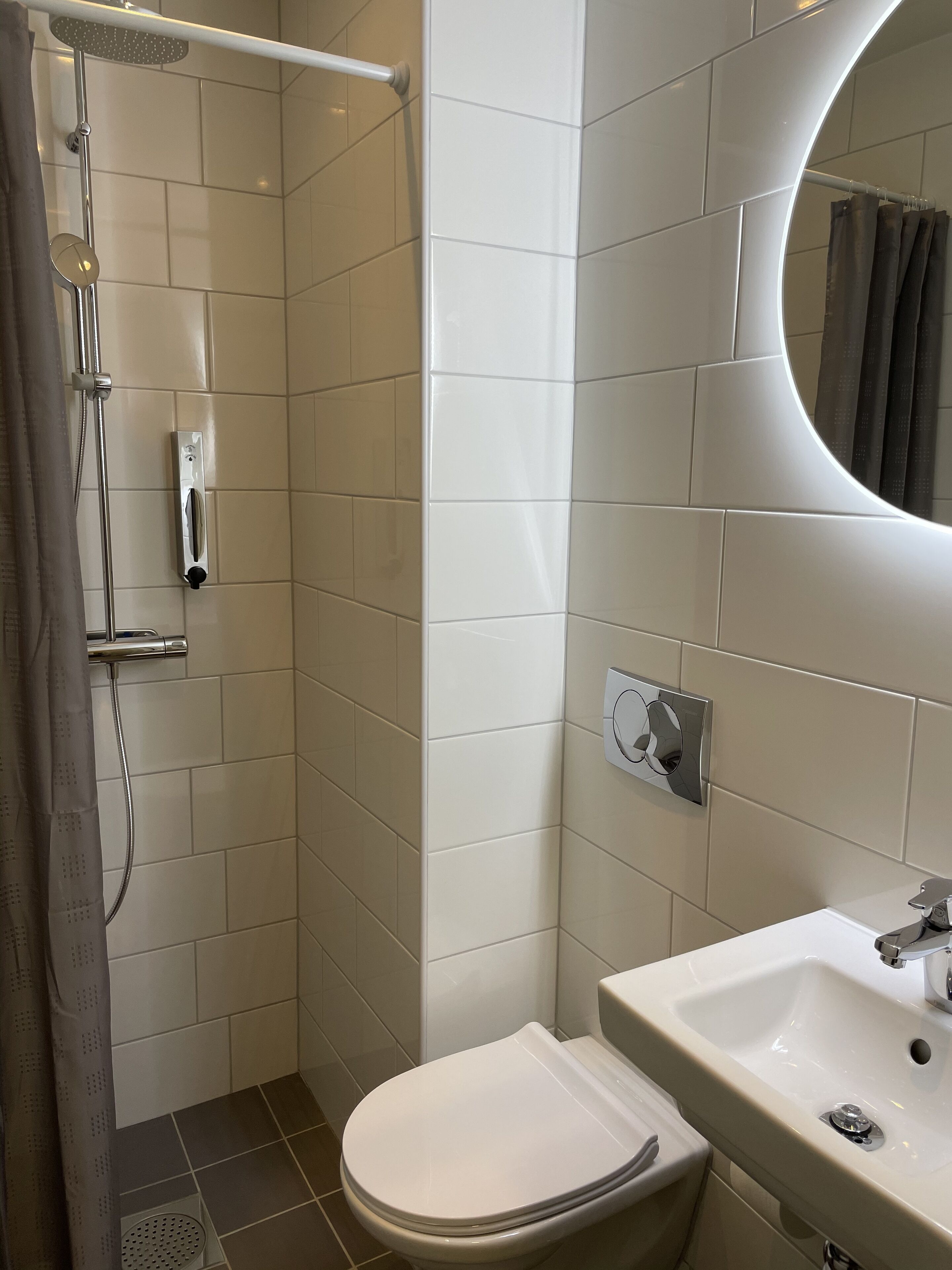 twin room | bathroom | shower, rainfall showerhead, hair dryer, heated floors