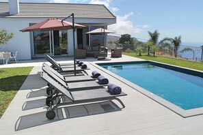 A heated pool, pool loungers