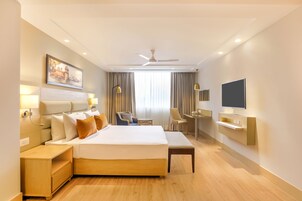 Habitación Deluxe | Escritorio, camas supletorias, wifi gratis y ropa de cama