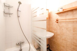 Bathtub, hair dryer, towels