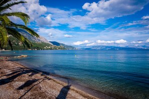 On the beach, sun loungers, beach umbrellas, beach towels