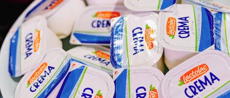 A plate of packaged yogurt with the brand name 'Lactolac Crema' visible.