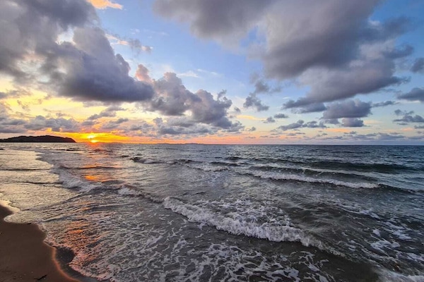 On the beach, sun-loungers, beach towels