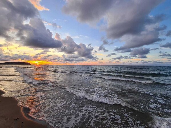 On the beach, sun-loungers, beach towels