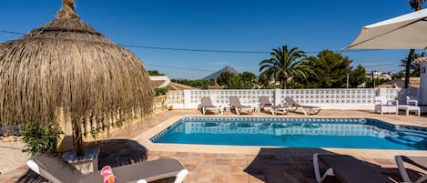 A heated pool, pool loungers