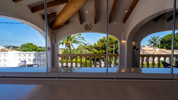 A balcony with a view of a garden and a mountain. - Villa for 7 (Xabia)