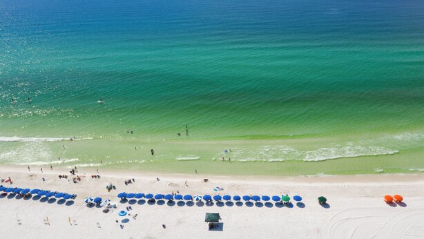 A beach with clear blue water, white sand, and umbrellas. - Deja Blue Too Studio at Tops'l, Pool, Beach (Miramar Beach)