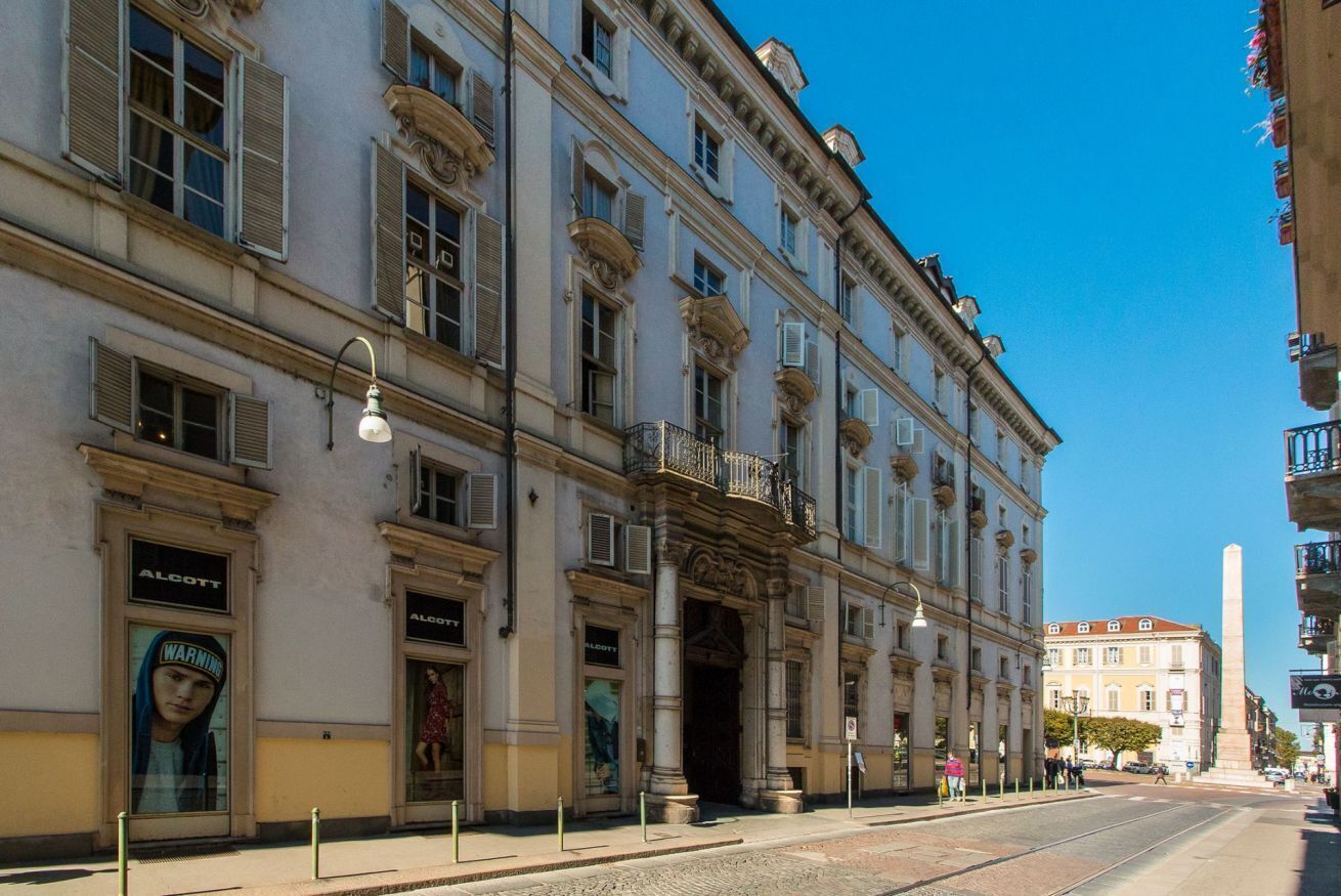 A historic building with classical architecture, featuring multiple windows and a prominent entrance.