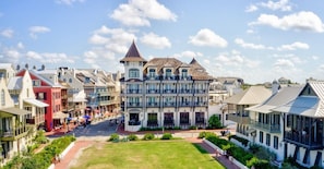 Stunning historic building with a prominent tower, blending traditional and modern elements, and offering large windows and balconies.