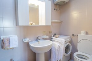 Apartment, 2 Bedrooms | Bathroom | Shower, rainfall showerhead, hair dryer, bidet - Lignano Sabbiadoro Flat with Garage (Lignano Sabbiadoro)