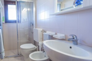 Apartment, 2 Bedrooms | Bathroom | Shower, rainfall showerhead, hair dryer, bidet - Lignano Sabbiadoro Flat with Garage (Lignano Sabbiadoro)