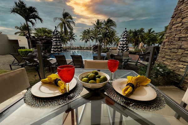 Outdoor dining by the pool on large patio