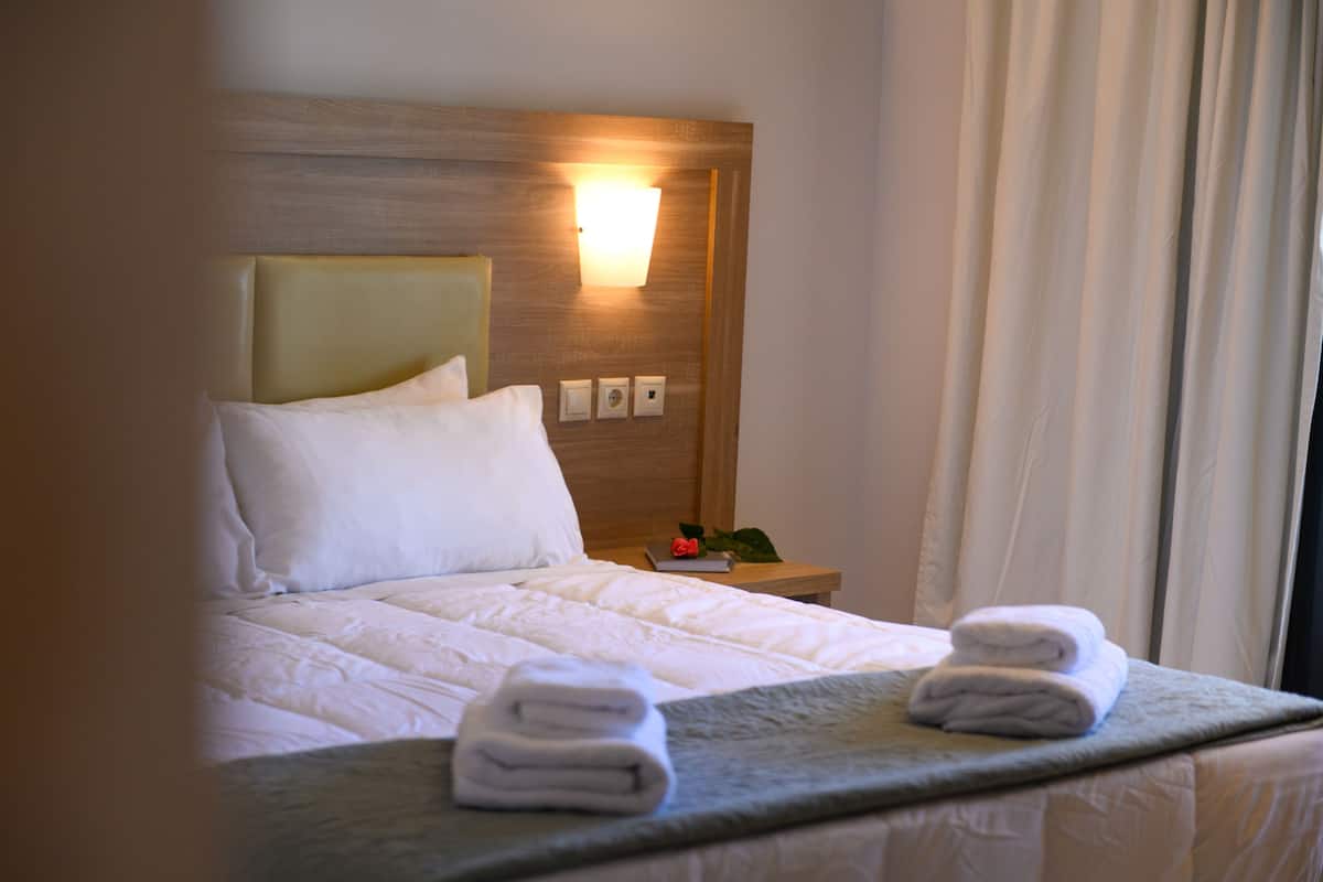 Hypo-allergenic bedding, desk, laptop workspace, blackout curtains