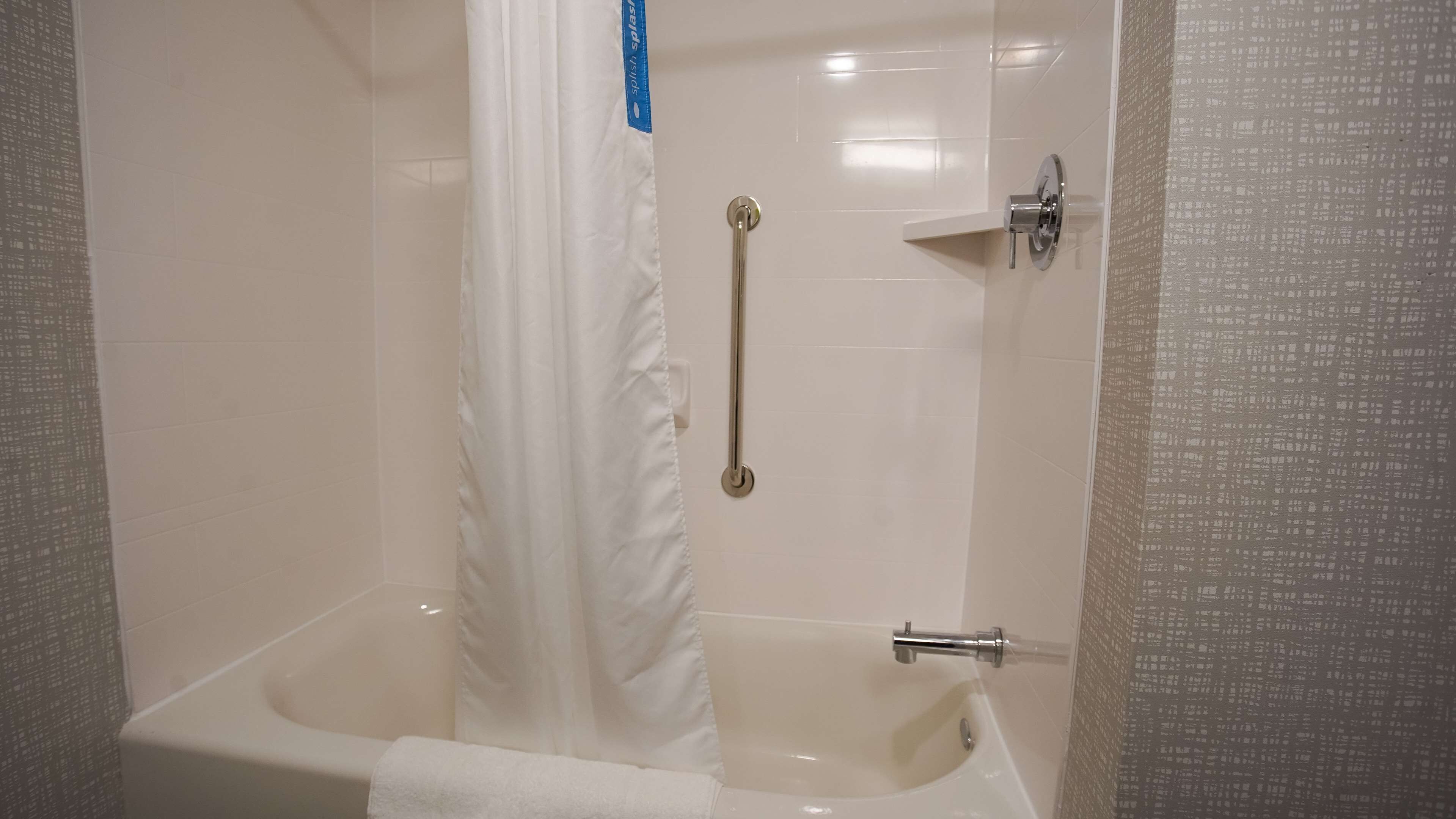room, 2 queen beds, refrigerator & microwave | bathroom | hair dryer, towels, soap, shampoo