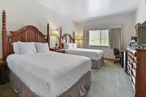 A hotel room with two large beds, a desk with a chair, a dresser, and a window with blinds. - Mtn Retreat: Relax Serene Nature, Hot Spring & Spa Villa 2013 (Midway)