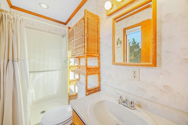 A bathroom with a shower, toilet, and sink. - Canalfront Dog Friendly Home w/ Private Dock, Cmty Pool and Tennis/Pickleball (Avon)