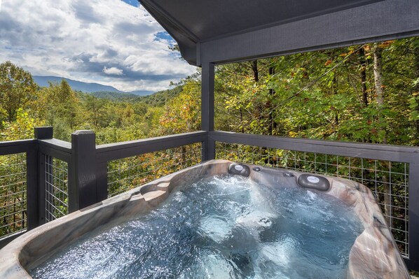 Outdoor spa tub - Stunning views, king bed, hot tub, arcade games, privacy. (Cosby)