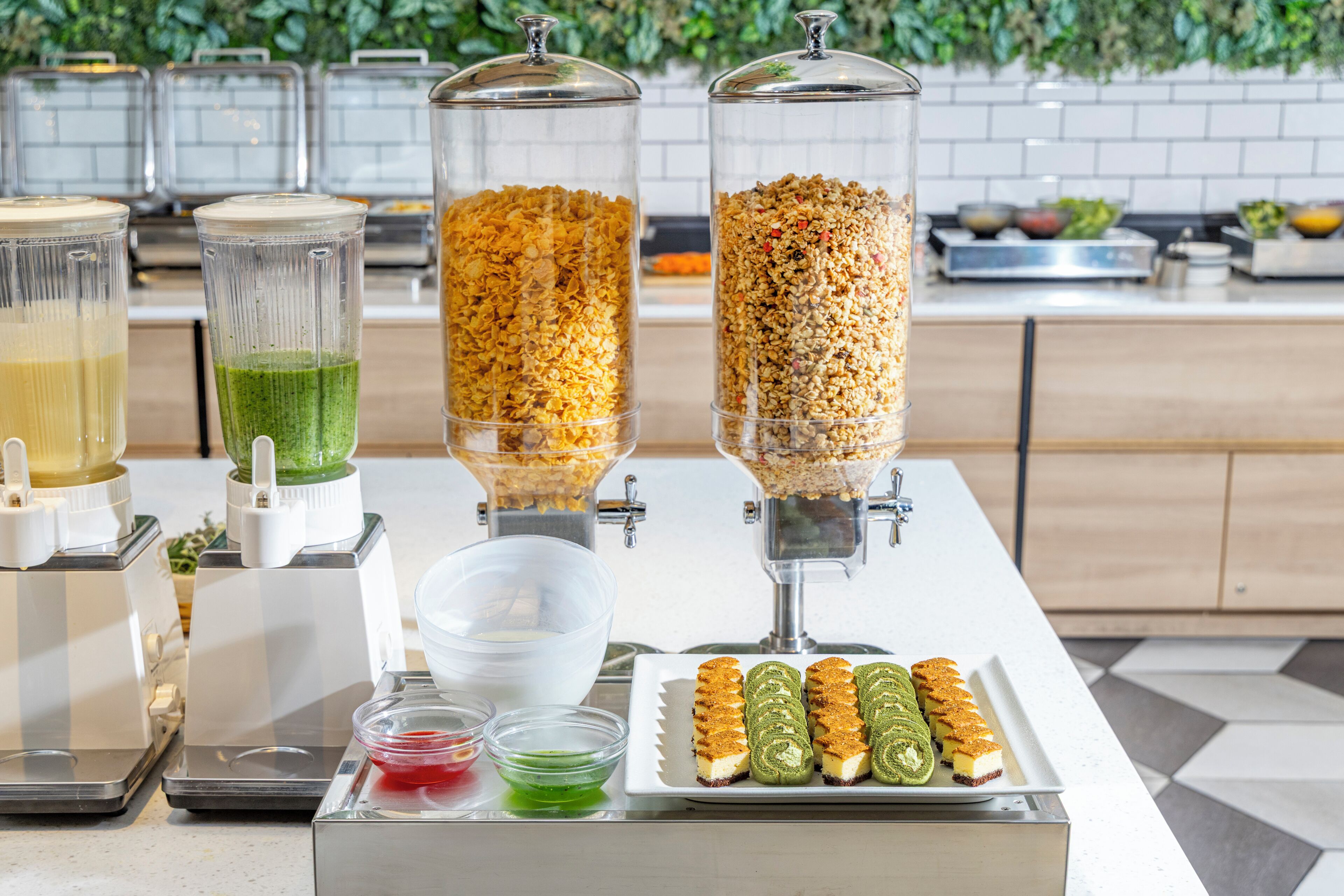 A buffet setup with various food items and beverages.