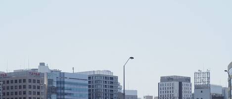 A cable car system with a modern cityscape in the background.