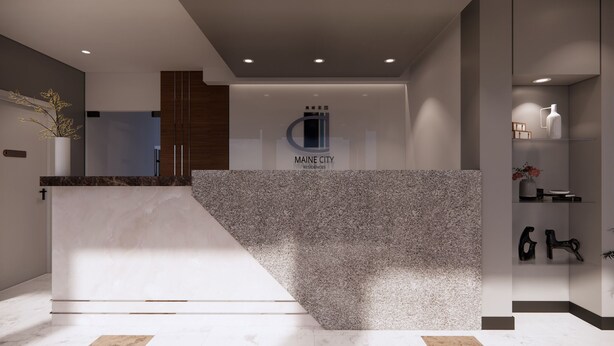Een modern ingerichte receptie met een marmeren balie, het logo van Maine City Residences, en een minimalistisch design.