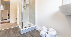 Shower, hair dryer, towels, soap