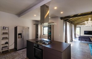 Fridge, stovetop, dishwasher, coffee/tea maker