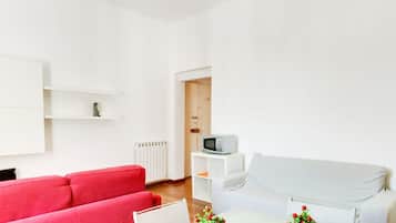 Apartamento, 1 quarto | Área de estar | TV de tela plana