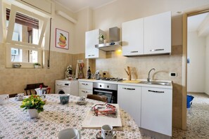 Apartment, 2 Bedrooms | Private kitchen | Mini-fridge, oven, coffee/tea maker - Tra il Centro e Il Mare Apartment con terrazzo (Aci Castello)